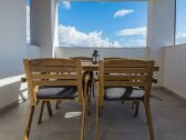 Roofed and furnished balcony