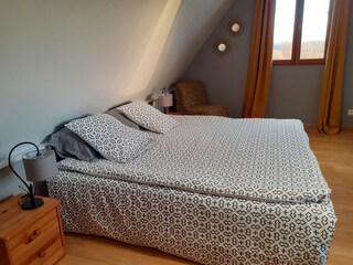 double bed in the large bedroom