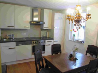 Dining room with modern built-in kitchen