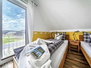 Ansicht des Schlafzimmers mit 2 getennten Betten, bei Anreise stehen die Betten immer als Doppelbett