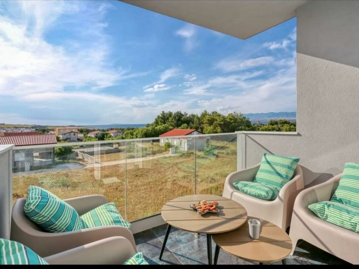 Roofed and furnished terrace  with a Partial sea view