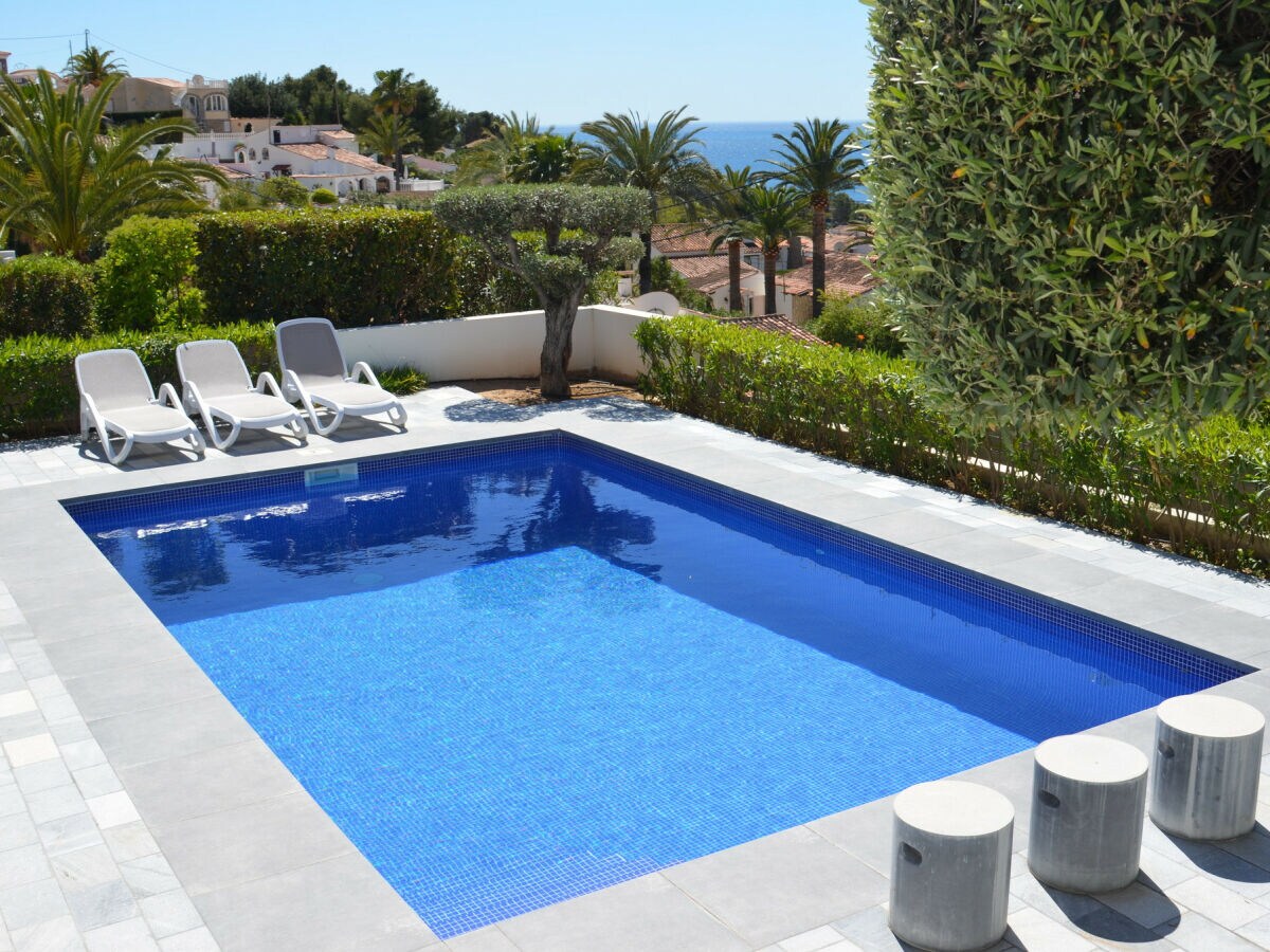 The villa has a private pool with sea view