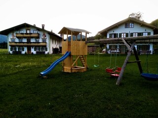 Swing with slide and sandpit