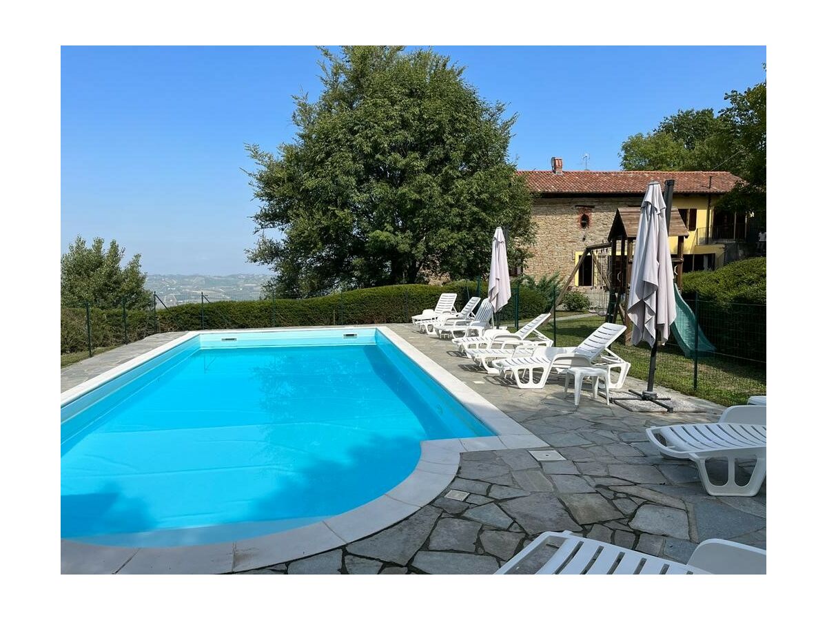 Pool with view to the house and valley