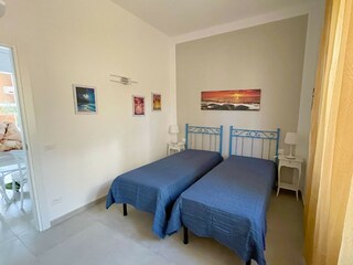 Room with two single beds