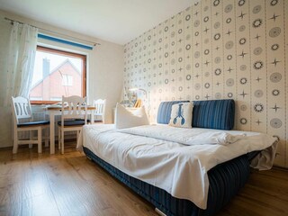 Wohnzimmer mit Schlafsofa