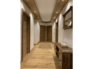 Hallway leading to 3 bedrooms and a large bathroom
