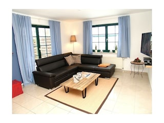 Wohnzimmer mit gemütlicher Sofaecke