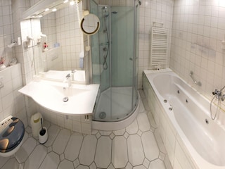 Bathroom with bathtub and shower