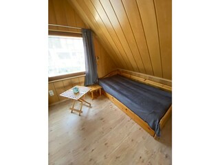Schlafzimmer mit ausziehbaren Bett
