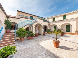 Appartement Cala Liberotto Buitenaudio-opname 1