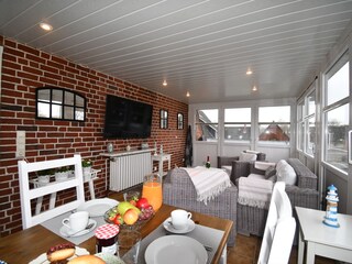 Wintergarten mit angrenzendem Balkon