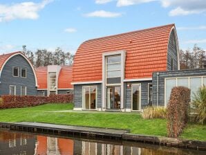 Ferienpark Ferienhaus mit Sauna, direkt am Wasser gelegen - De Groeve - image1