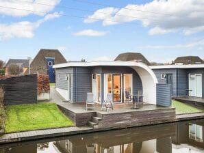 Parc de vacances Bungalow avec sauna et bain à remous, dans un parc - De Groeve - image1