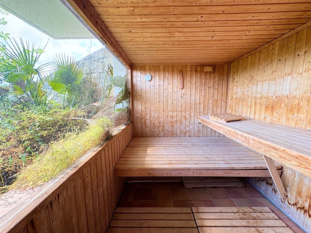 Protected sauna undre the pool with privacy