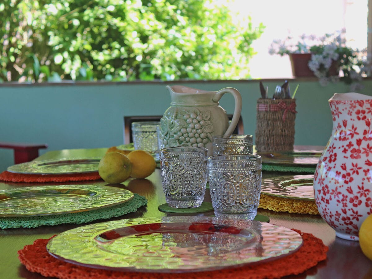 Casa Polly - Veranda mit Tisch und Stühlen