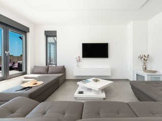 Das Wohnzimmer mit Terrassenausgang