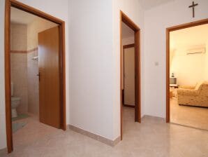 Two bedroom apartment with balcony and sea view Seget Vranjica, Trogir (A-8507-b) - Seget Vranjica - image1