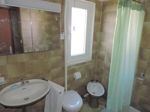 Two bedroom apartment with terrace and sea view Seget Vranjica, Trogir (A-975-a) - Seget Vranjica - image1