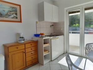 One bedroom apartment with balcony and sea view Sumpetar, Omiš (A-11798-b) - Jesenice near Dugi Rat - image1