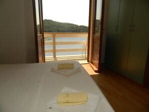 One bedroom apartment with balcony and sea view Povlja, Brač (A-14399-d) - Povlja - image1