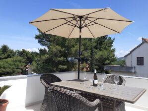 Two bedroom apartment with terrace and sea view Jelsa, Hvar (A-13513-b) - Jelsa - image1