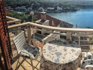 Two bedroom apartment with balcony and sea view Povlja, Brač (A-14399-c) - Povlja - image1