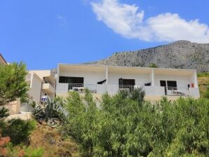 One bedroom apartment with balcony and sea view Lokva Rogoznica, Omiš (A-17645-c) - Ruskamen - image1