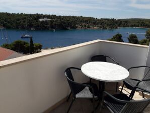 Two bedroom apartment with terrace and sea view Milna, Brač (A-18743-a) - Milna (Brač) - image1