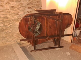 Entrance of the house with an ancient wooden machine