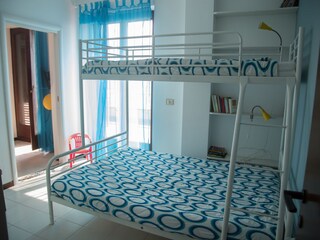 bedroom- passage to living room & kitchen