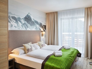Alpenwohnen.L - Schlafzimmer - Wohnbeispiel