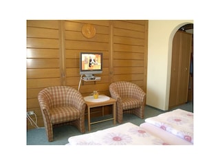 Schlafzimmer mit Sitzmöglichkeit