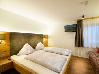 Schlafzimmer im Appartement Zwergerl