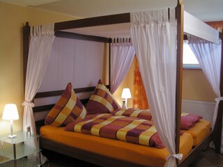 Romantic bedroom with four poster bed and TV / DVD