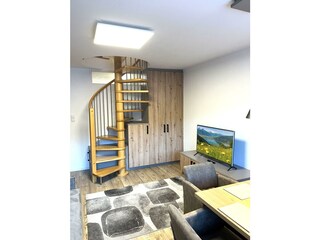 Penthouse 82 Kaprun Living Room Stairs & TV