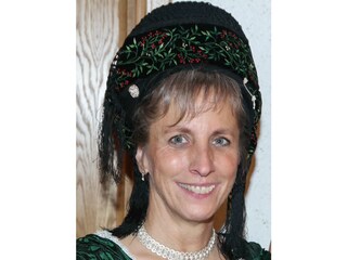 Your hostess in traditional Frisian costume
