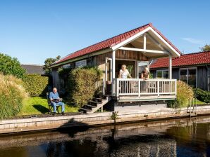 Holiday park Beautiful chalet with sauna and right on the water - Akkrum - image1