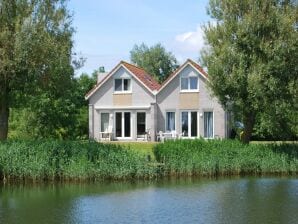 Parc de vacances Belle maison de vacances au bord de l'eau en Frise - Makkoum - image1