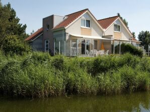 Parc de vacances Maison de vacances au bord de l'eau en Frise - Makkoum - image1