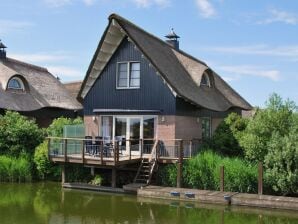 Parc de vacances Villa avec terrasse sur l'eau en Frise - Makkoum - image1