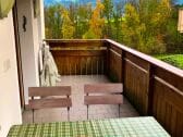 25 mq balcony with table and deck chairs