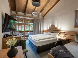 Schlafzimmer mit Sichtdachstuhl