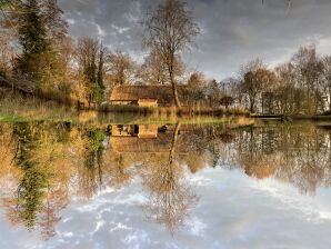 Ferienwohnung Reetdachhaus mit See im Herzen Ostfrieslands - Leezdorf - image1