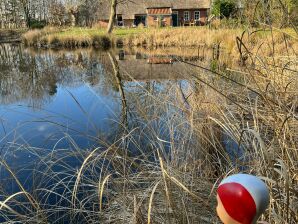 Ferienwohnung Reetdachhaus mit See im Herzen Ostfrieslands - Leezdorf - image1