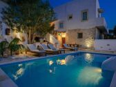 Private pool and yard night view