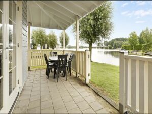 Prachtig vakantiehuis aan het water met terras - Simonshaven - image1