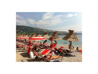 On beach you can rent deck chairs and sunshade.
