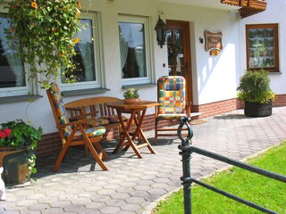 Covered outdoor seating area at Dorothee House