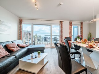 Wohnzimmer mit holzbefeuertem Kamin , Lootsen Hus by Seeblick Ferien ORO, Schlafsofa